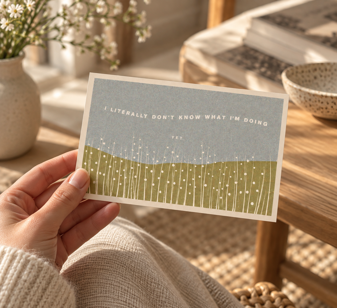 Hand holding the I Don't Know What I'm Doing (Yet) postcard to show its real size